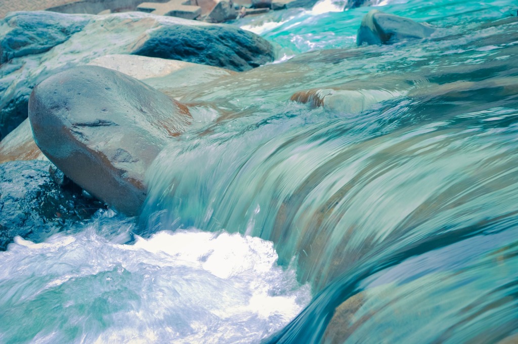Stream of water flowing over rocks.